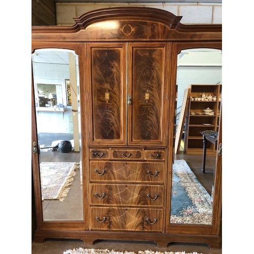 91 - Large triple Edwardian Wardrobe with inlay, drawers, mirrored doors and shelves, a fine example reta... 