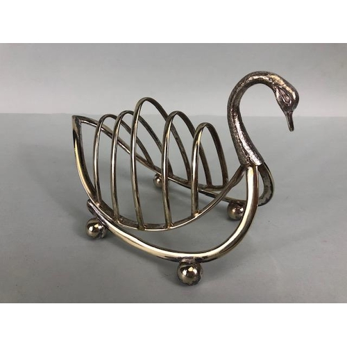 104 - Antique silver plate, EPNS Swan toast rack, shell caddy spoon, trowel server, and three rat tail tab... 