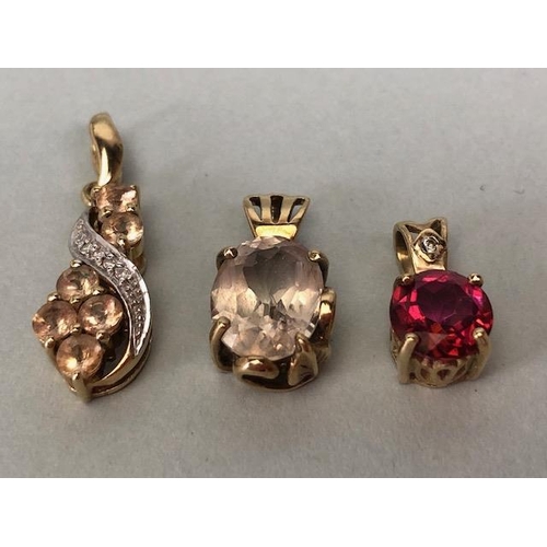 12 - Three 9ct Gold pendants set with various gemstones (3)