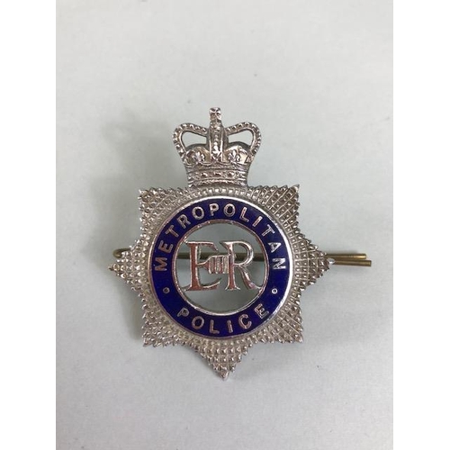 122 - Military and Police interest, collection of Badges and medals to a former Metropolitan Police office... 