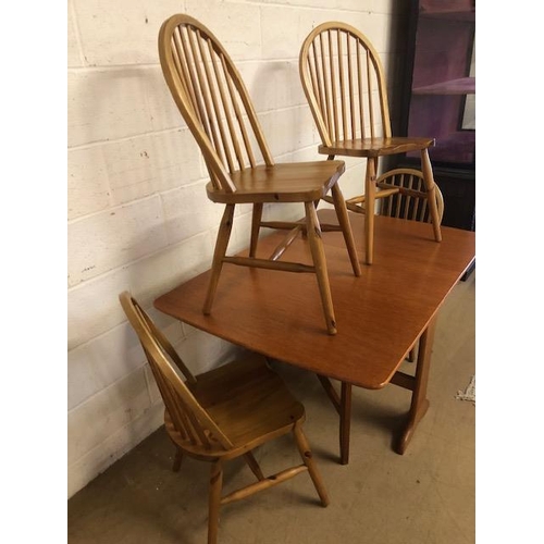 131 - Teak mid century style drop leaf table and four pine chairs