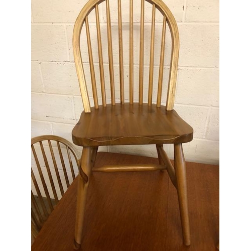 131 - Teak mid century style drop leaf table and four pine chairs