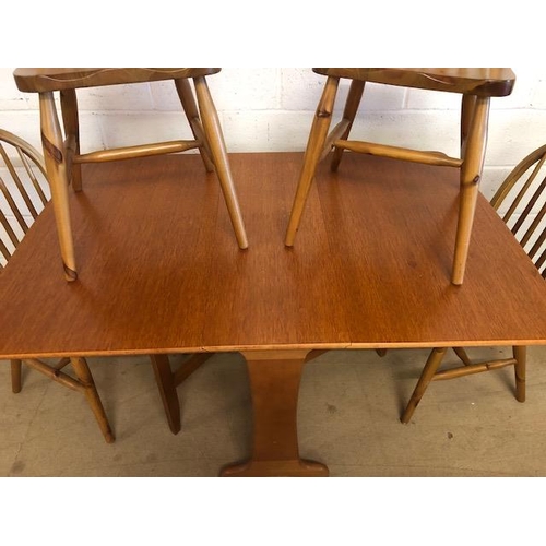 131 - Teak mid century style drop leaf table and four pine chairs