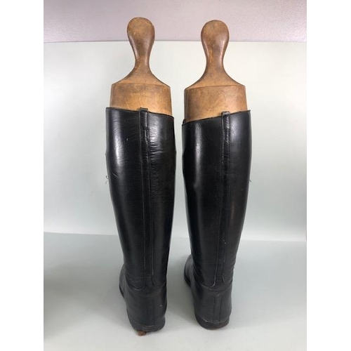 135 - Equestrian racing interest, pair of vintage leather riding  boots with their wooden trees and a vint... 