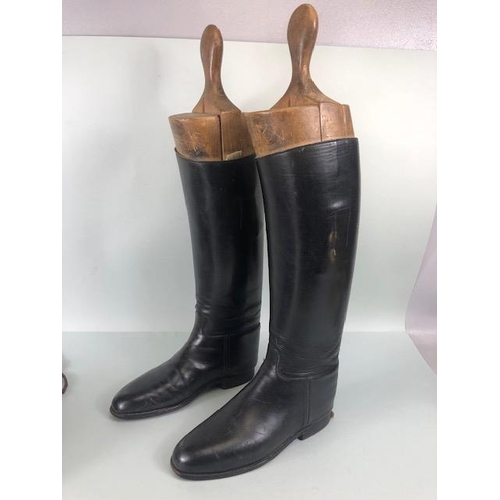 135 - Equestrian racing interest, pair of vintage leather riding  boots with their wooden trees and a vint... 