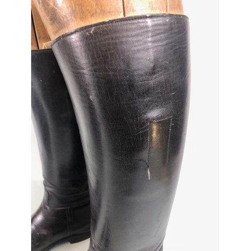 135 - Equestrian racing interest, pair of vintage leather riding  boots with their wooden trees and a vint... 