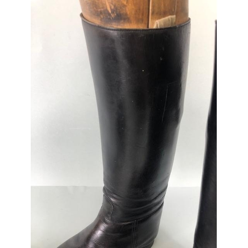 135 - Equestrian racing interest, pair of vintage leather riding  boots with their wooden trees and a vint... 