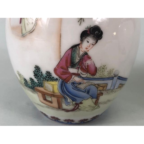 139 - Oriental ceramics, pair of Chinese Famille Rose vases decorated with a young woman in a garden, red ... 