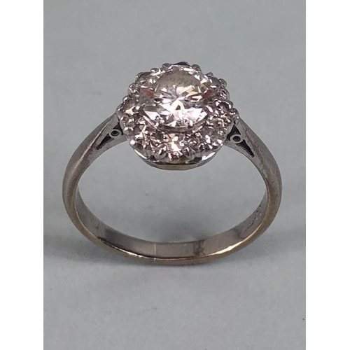 15 - 18ct White Gold daisy style ring set with a central diamond of approx 1ct and surrounded by eight cl... 