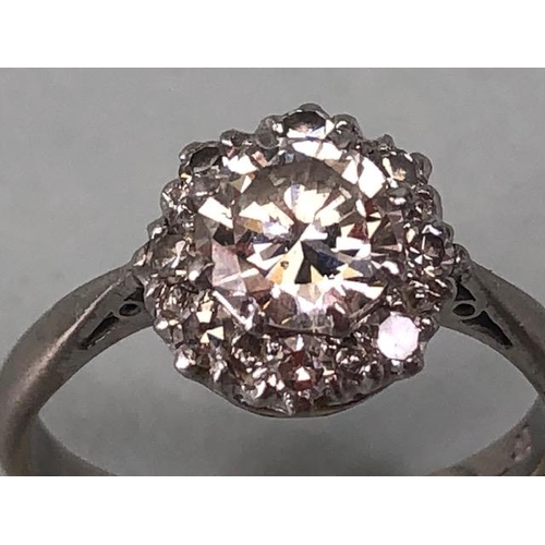 15 - 18ct White Gold daisy style ring set with a central diamond of approx 1ct and surrounded by eight cl... 