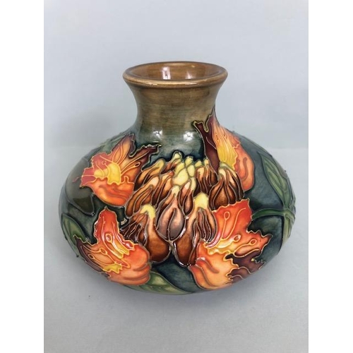 150 - Moorcroft pottery,  Flame of the Forest design marked to base 97, WM with Moorcroft stamp, Orchid de... 