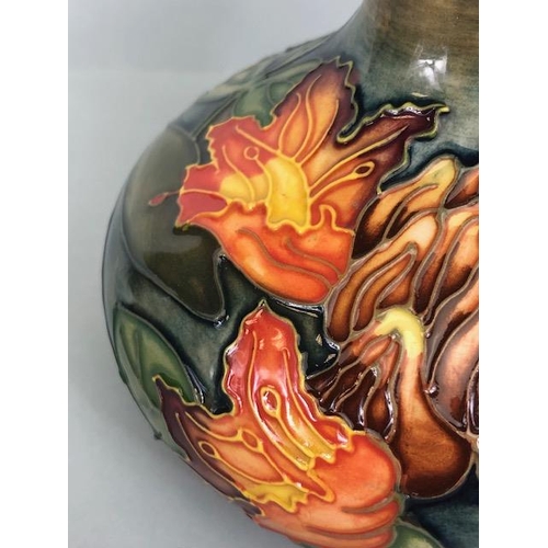 150 - Moorcroft pottery,  Flame of the Forest design marked to base 97, WM with Moorcroft stamp, Orchid de... 