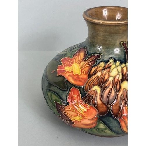 150 - Moorcroft pottery,  Flame of the Forest design marked to base 97, WM with Moorcroft stamp, Orchid de... 