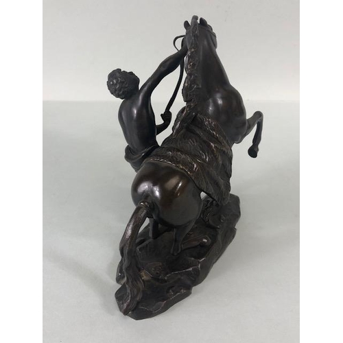 157 - Antique bronze sculpture of a young man and horse, in the manner of the Marly horse groups, signed t... 