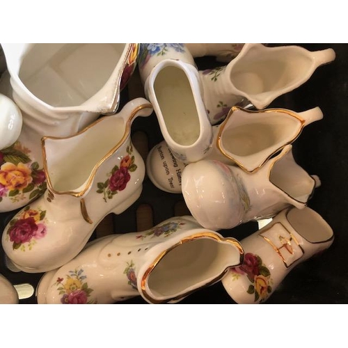 158 - Collectable ceramics, quantity of china  boots and shoes from various makers, to include some town a... 