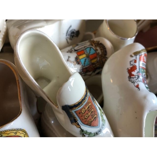 158 - Collectable ceramics, quantity of china  boots and shoes from various makers, to include some town a... 