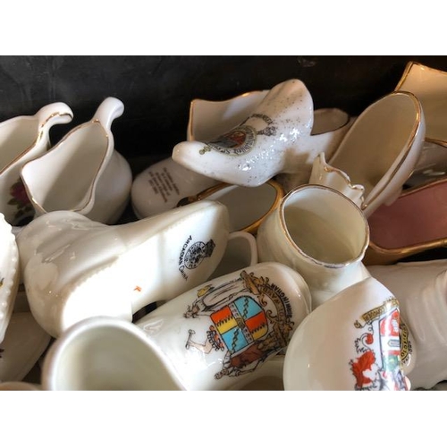 158 - Collectable ceramics, quantity of china  boots and shoes from various makers, to include some town a... 