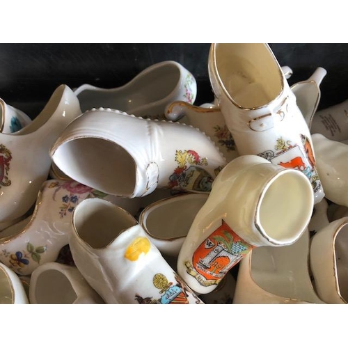 158 - Collectable ceramics, quantity of china  boots and shoes from various makers, to include some town a... 