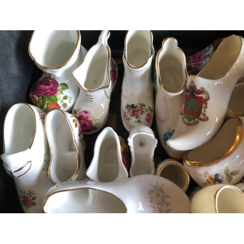 158 - Collectable ceramics, quantity of china  boots and shoes from various makers, to include some town a... 