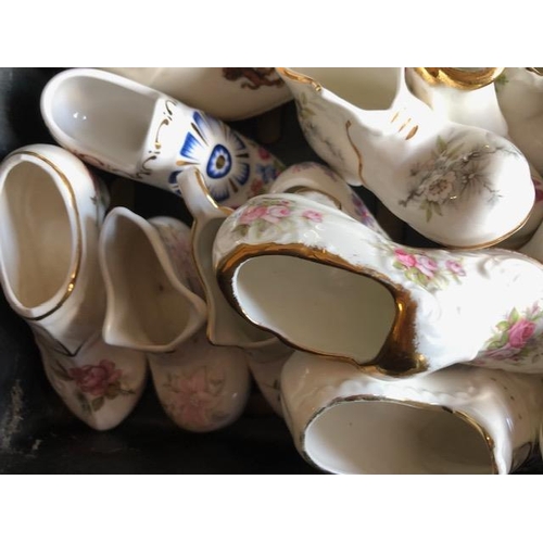 158 - Collectable ceramics, quantity of china  boots and shoes from various makers, to include some town a... 