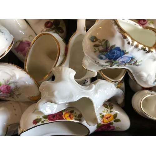 158 - Collectable ceramics, quantity of china  boots and shoes from various makers, to include some town a... 