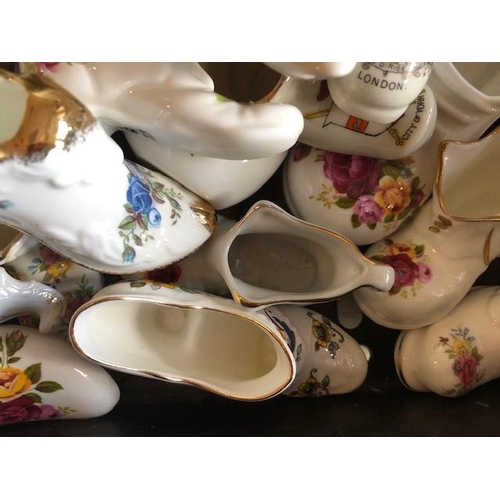 158 - Collectable ceramics, quantity of china  boots and shoes from various makers, to include some town a... 