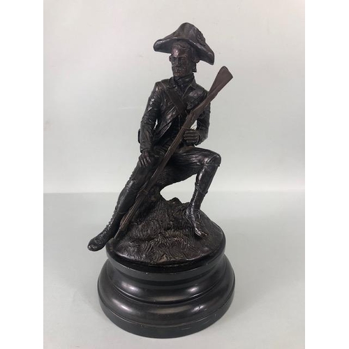 167 - Bronze statue of solider in french military uniform holding a musket, sat on a tree stump signed Ran... 