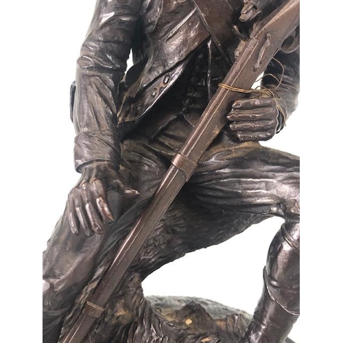 167 - Bronze statue of solider in french military uniform holding a musket, sat on a tree stump signed Ran... 