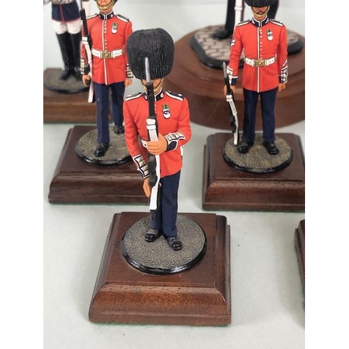 177 - Military Interest, collection of finely hand painted diecast figures of guardsmen, all mounted on wo... 