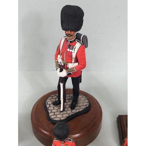 177 - Military Interest, collection of finely hand painted diecast figures of guardsmen, all mounted on wo... 