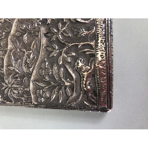 23 - Anglo-Indian silver card case with hinged lid and all over repousse decoration including tigers and ... 