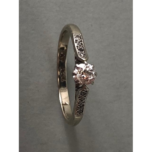 29 - Platinum and diamond set ring with central Diamond enhanced bi diamond set shoulders approx size 'L'