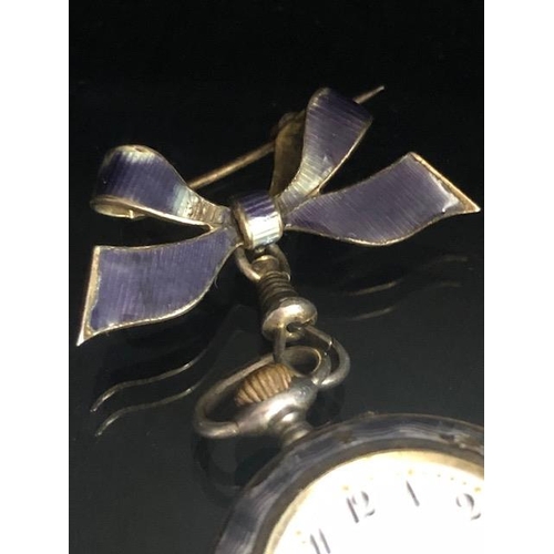 38 - Silver 925 brooch style fob watch with white ceramic face on a bow clasp with all over purple enamel... 