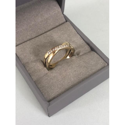 41 - 9ct yellow gold cross over design ring set with 10 diamonds approximately 2.27g an size M