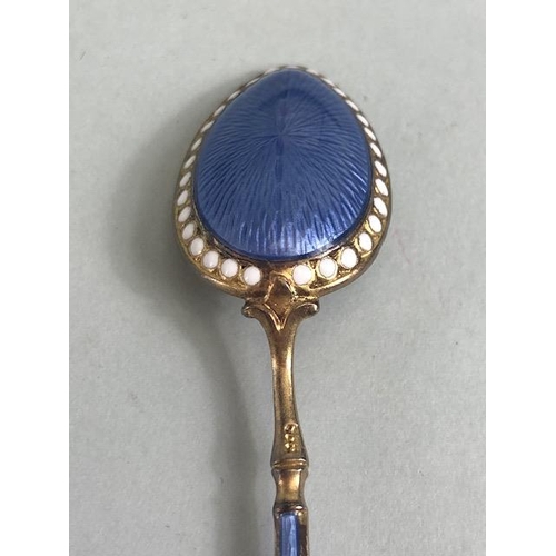 46 - Antique Silver, cased set of six continental silver gilt egg spoons with pale blue and white enamel ... 