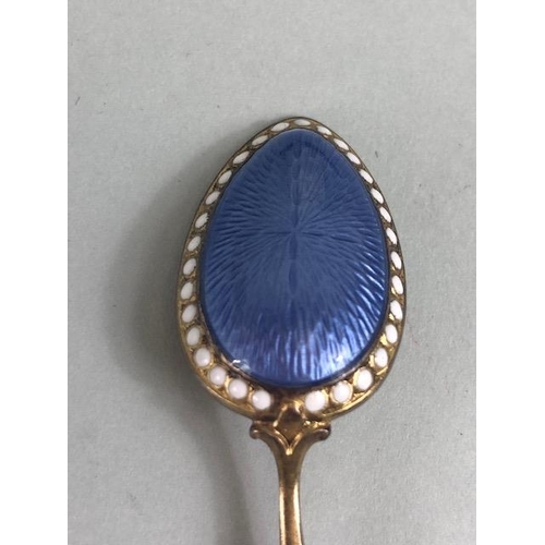 46 - Antique Silver, cased set of six continental silver gilt egg spoons with pale blue and white enamel ... 