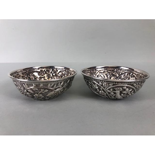 48 - Pair of white metal silver coloured Ottoman bowls with heavy repoussé work depicting birds and flowe... 