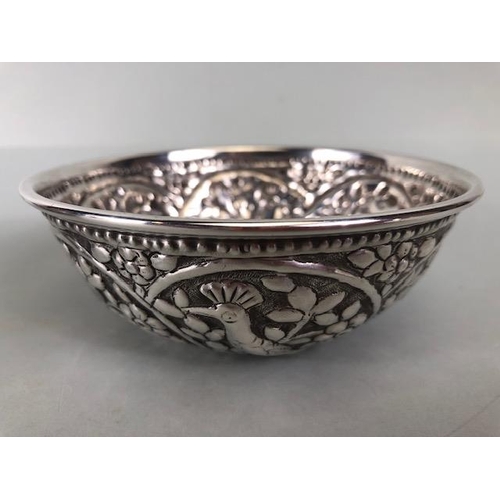 48 - Pair of white metal silver coloured Ottoman bowls with heavy repoussé work depicting birds and flowe... 