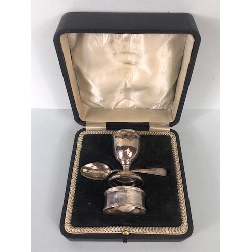 52 - Hallmarked silver and boxed christening set comprising egg cup spoon and napkin ring