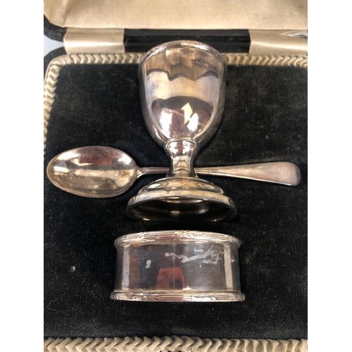 52 - Hallmarked silver and boxed christening set comprising egg cup spoon and napkin ring