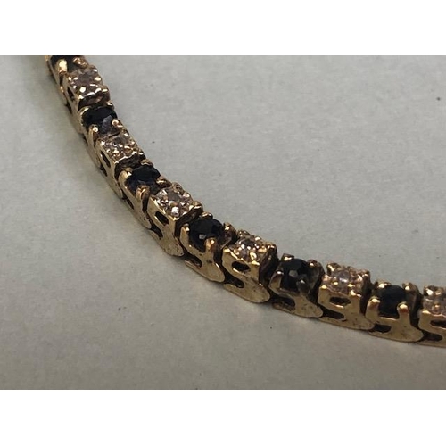 55 - 10k marked gold tennis bracelet set with alternate sapphires and diamonds approximately 64 stones, t... 