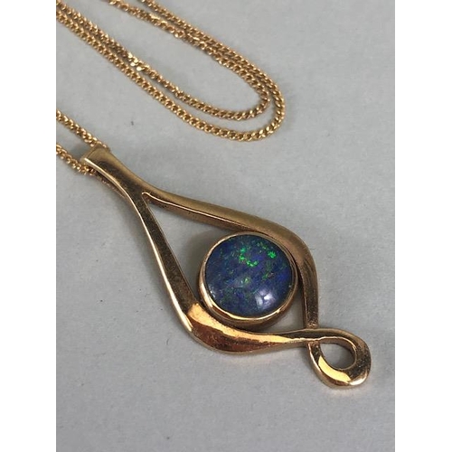 59 - 9ct gold twist pendant set with a black opal doublet, on a fine curb link chain approximately 4.02g ... 