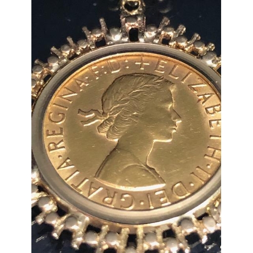 64 - Gold sovereign QEII for 1950 in a 9ct gold pendant mount, suspended from a 9ct belcher chain approxi... 