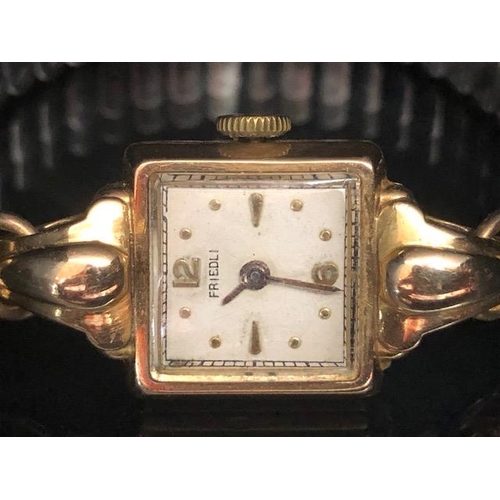 69 - !8ct gold cased square faced ladies wrist watch by Friedli, on an expanding bracelet