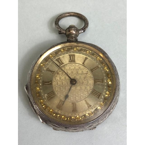 74a - Antique silver fob watch, case marked Fine silver, face with Roman numerals and gilt decoration  (no... 