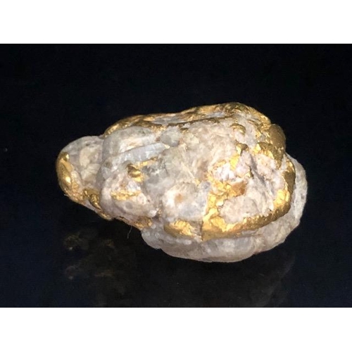 81 - Gold Specimen interest, rare opportunity to purchase a smooth gold and quartz nugget as dredged from... 