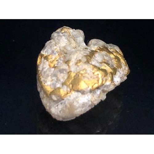 81 - Gold Specimen interest, rare opportunity to purchase a smooth gold and quartz nugget as dredged from... 