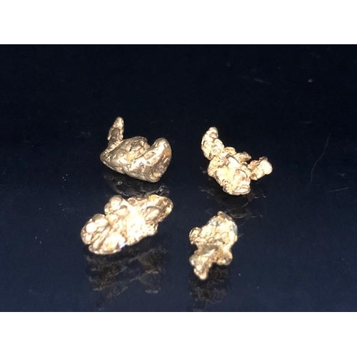 83 - Gold Specimen interest, rare opportunity to purchase four rough gold nuggets as dredged from the Fea... 