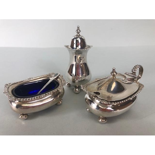 85 - Collection of hallmarked silver condiments to include Salts, spoon and a pepper pot one salt with bl... 