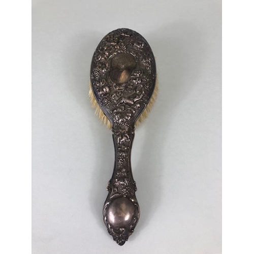 87 - Antique Silver, silver hallmarked hair brush and comb, decorated with flying cherubs and grape vines